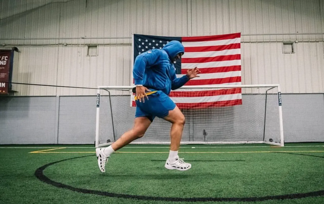 An athlete training on the indoor turf at Livonia Athletic District